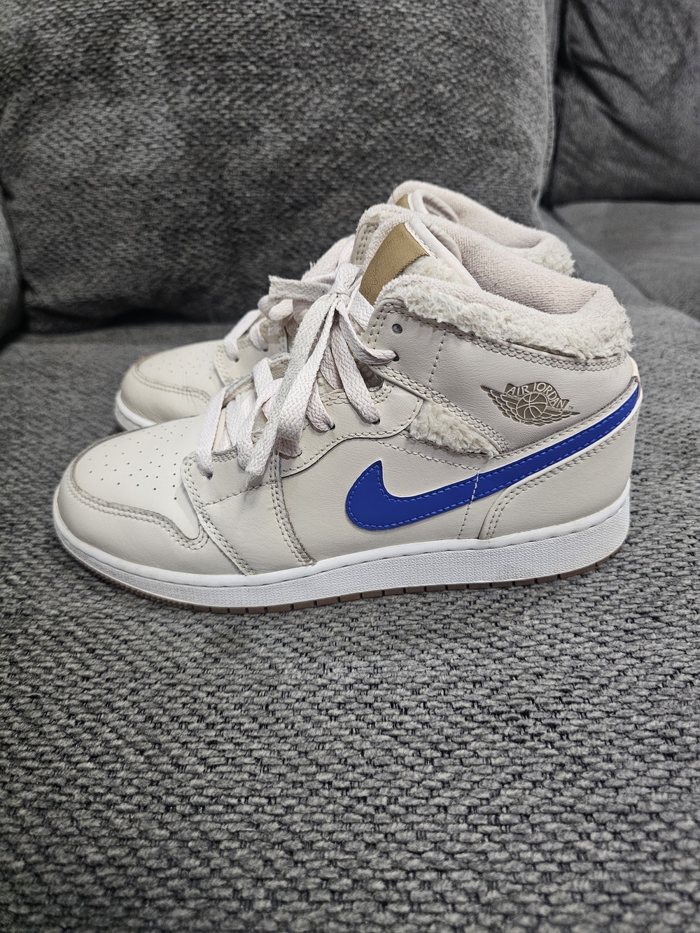 Jordan 1 Mid Women’s Sneakers in Cream with Blue Swoosh